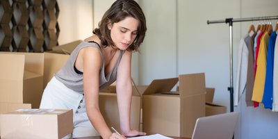 Clothing seller among parcels (Pexels 7857557)